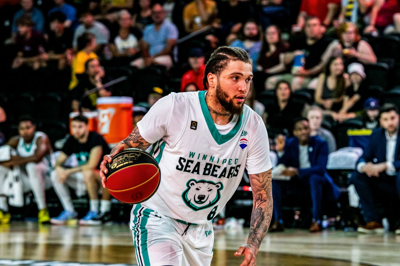 Teddy Allen (No.8) of Winnipeg Seabear moves up the court in...