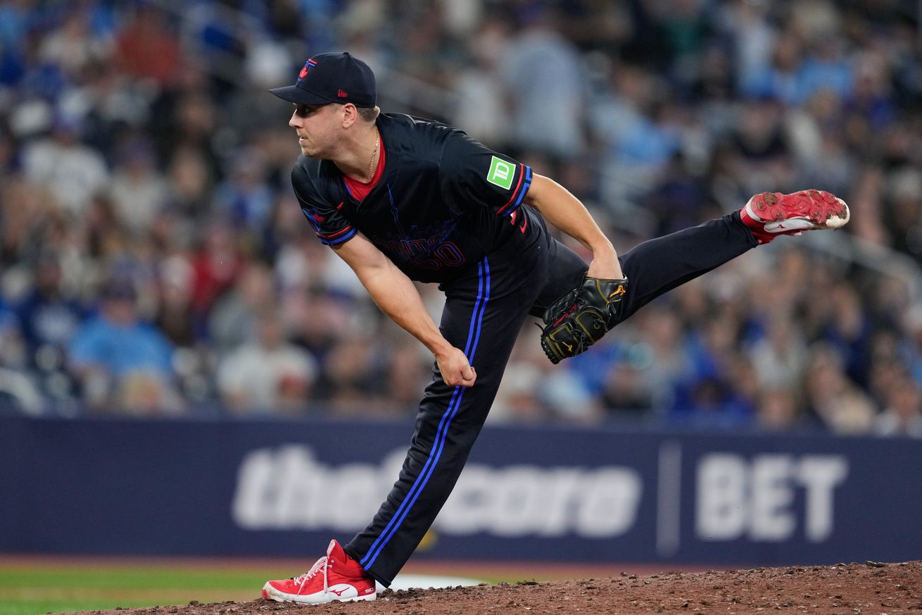 Erik Swanson #50 of the Toronto Blue Jays pitches during the game between the Los Angeles Angels and the Toronto Blue Jays at Rogers Centre on Friday, August 23, 2024