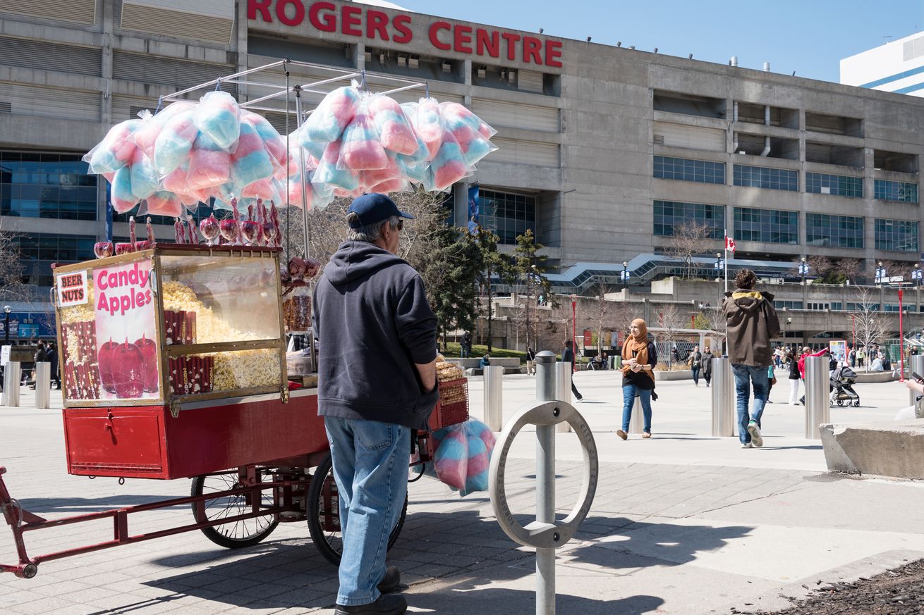 Self employed man selling cotton candy in front of Roger...