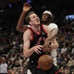 Indiana Pacers center Myles Turner makes a play against Toronto Raptors center Jakob Poeltl