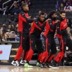 Toronto Raptors players dance near bench